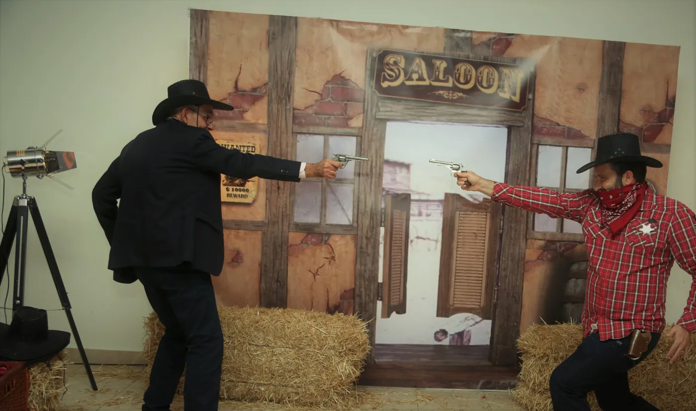 Mock cowboy duel in front of the saloon photocall