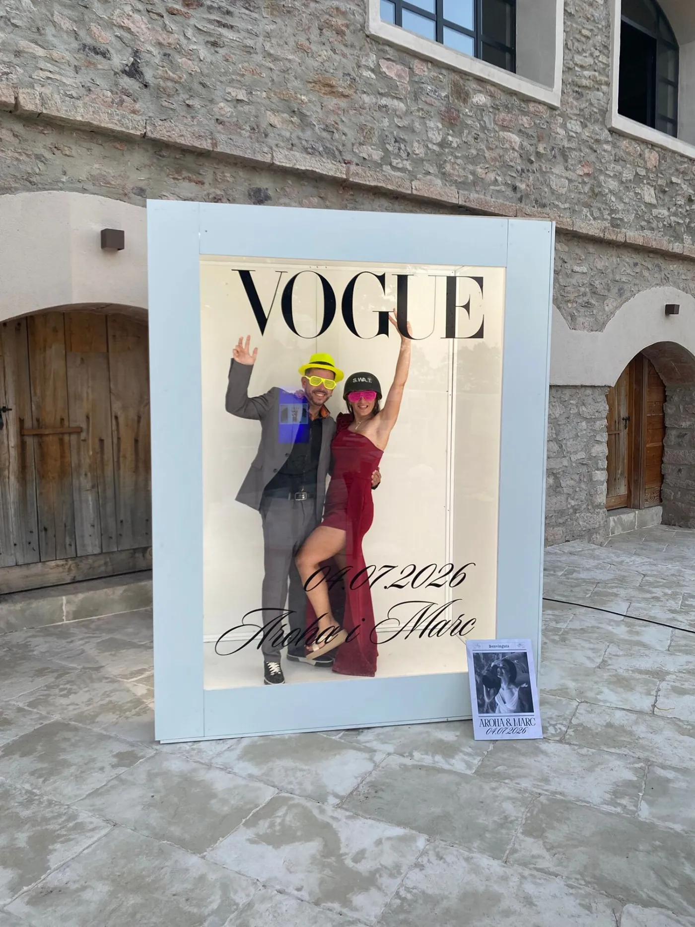 Vogue photocall in a farmhouse courtyard with a couple inside